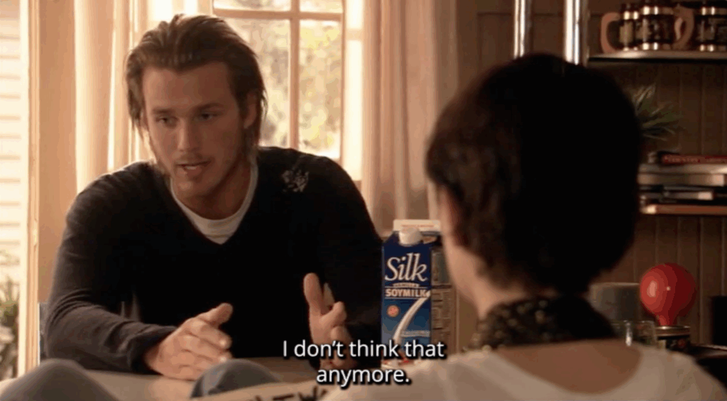 A white man sitting at a table. The subtitle text reads, "I don't think that anymore."